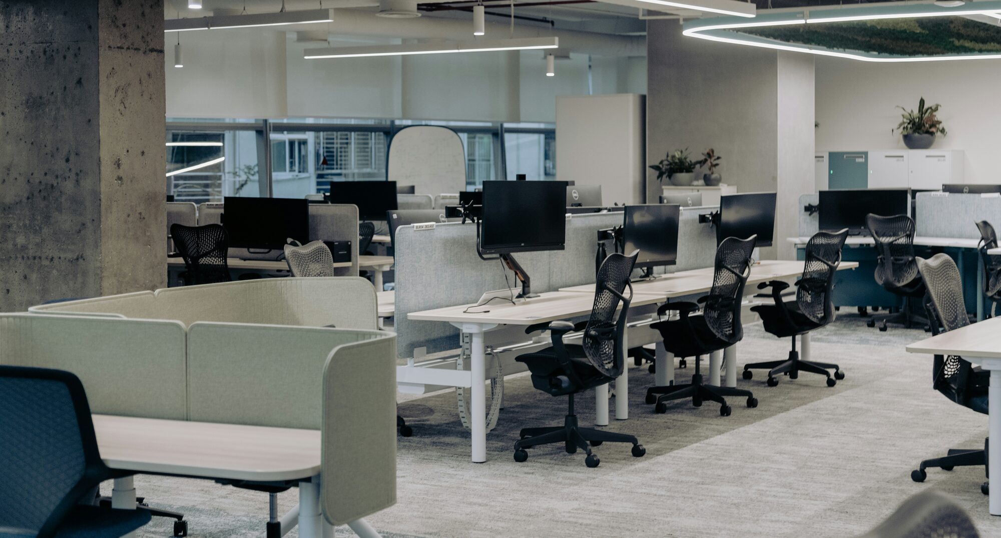 Professional office workspace with masonry samples, technical drawings, and restoration documentation